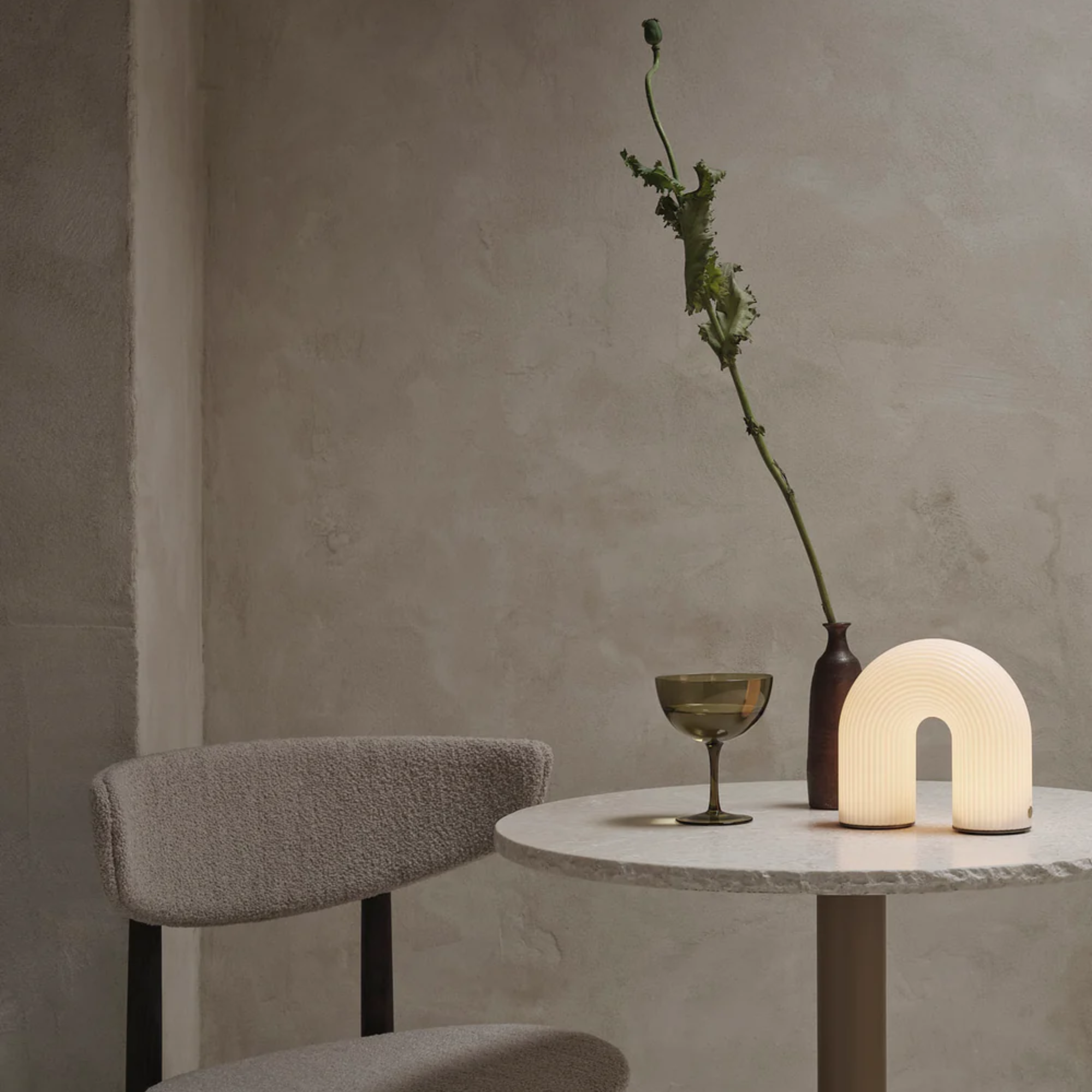 The Vuelta Portable Lamp from ferm LIVING in a dining room.