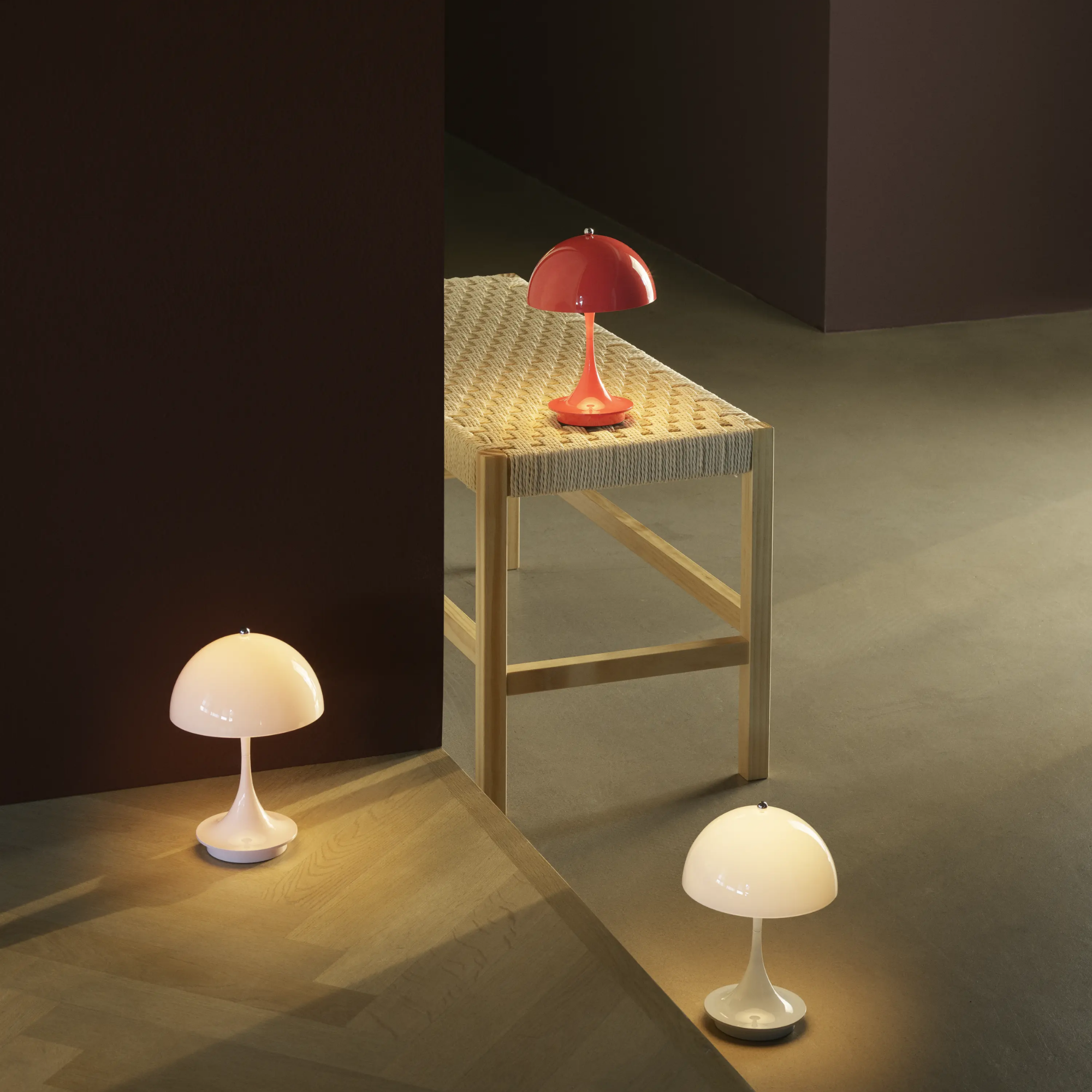 The pale blue opal Panthella 160 Portable Lamp from Louis Poulsen in a living space with other lighting fixtures.
