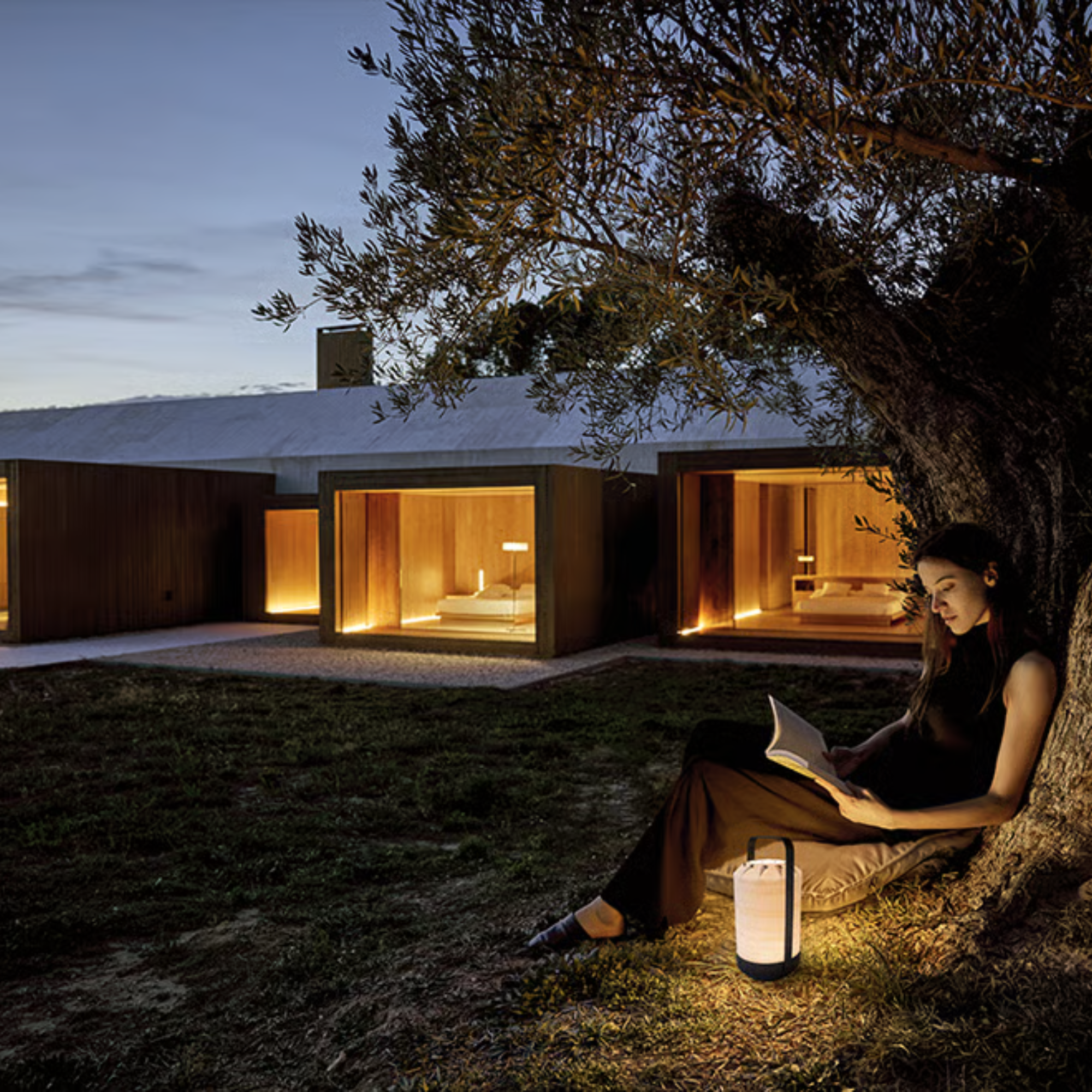 The Mini Chou Cordless Table Lamp from LZF in an outdoor living space. all-groups