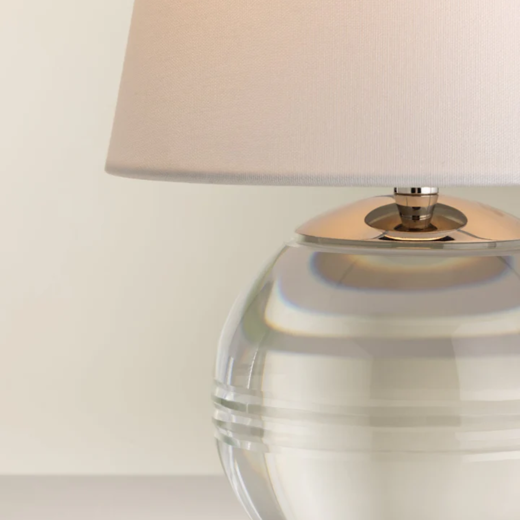 The Nicole Rechargeable LED Table Lamp from Mitzi shown in detail, highlighting the linen shade, nickel stem and crystal base.