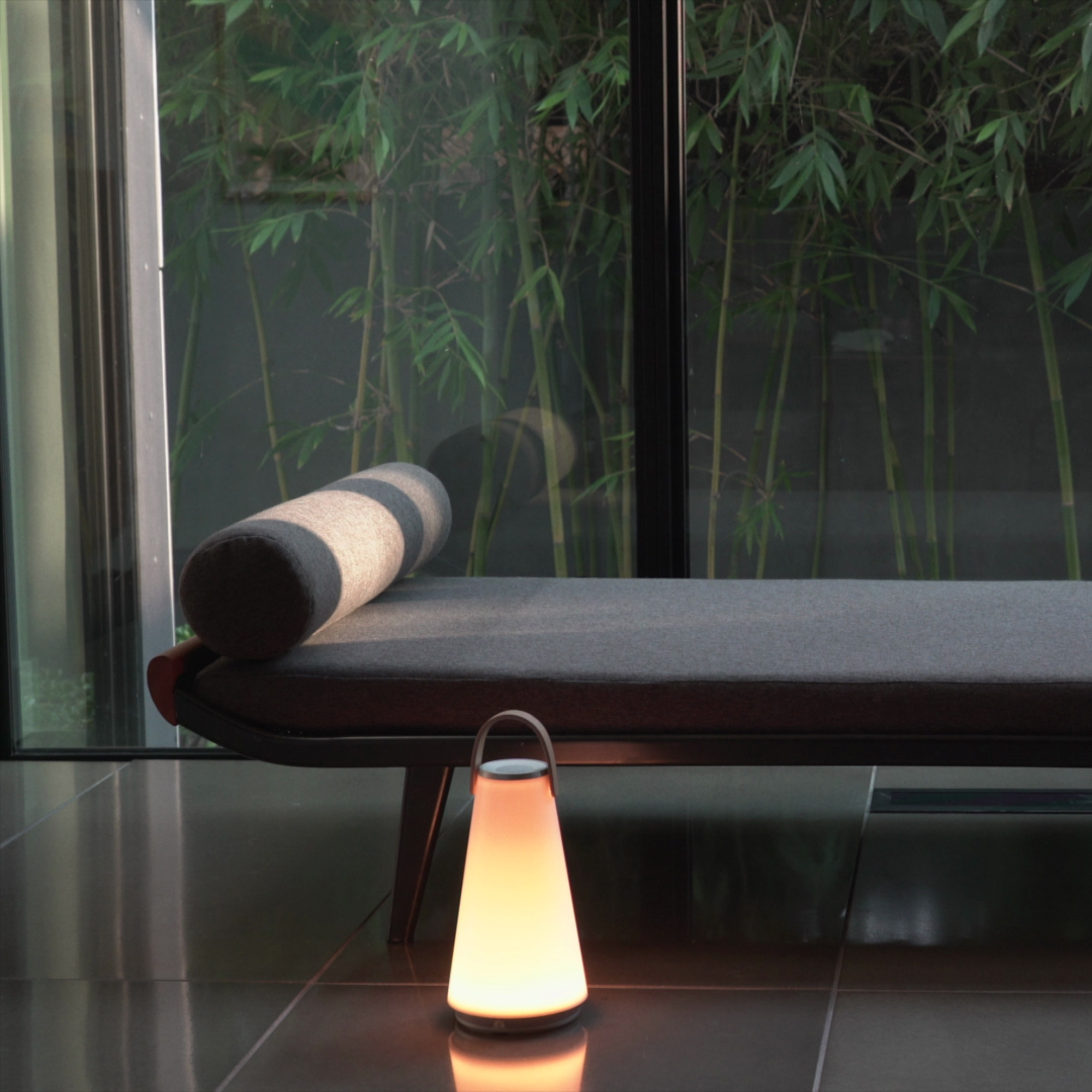 The Uma Sound Table Lamp from Pablo Designs in a home office.