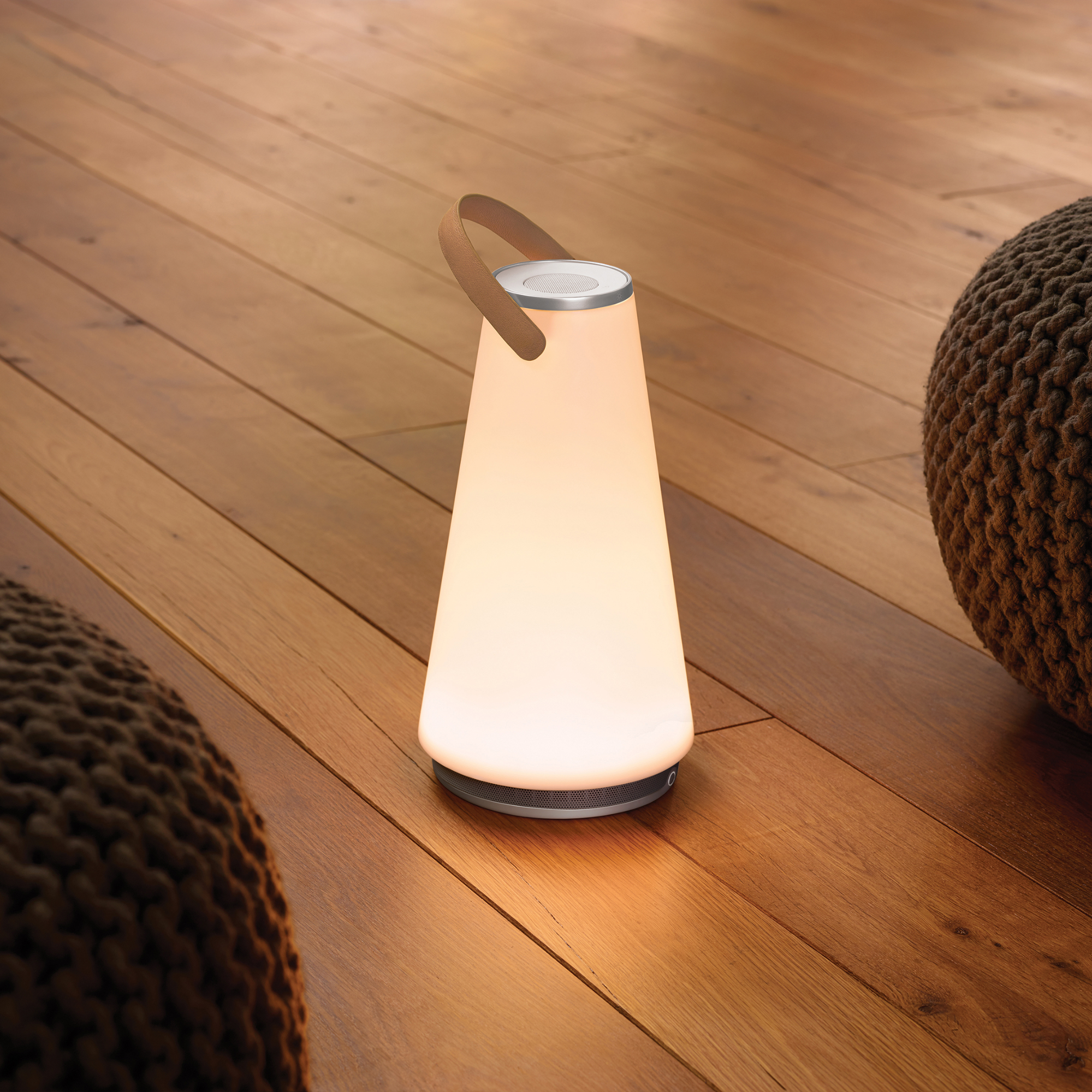 The Uma Sound Table Lamp from Pablo Designs in a lounge.