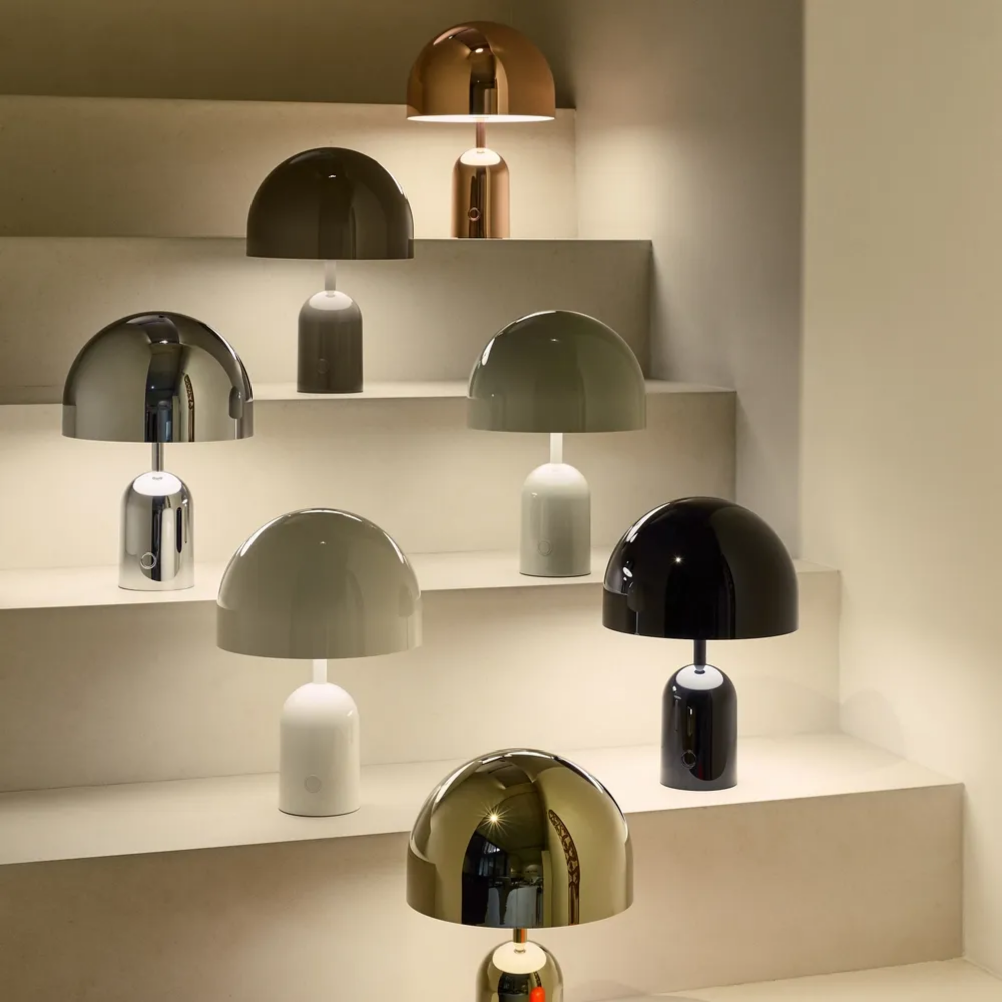 Seven of the ten color options available for the Bell Cordless Lamp from Tom Dixon. all-groups