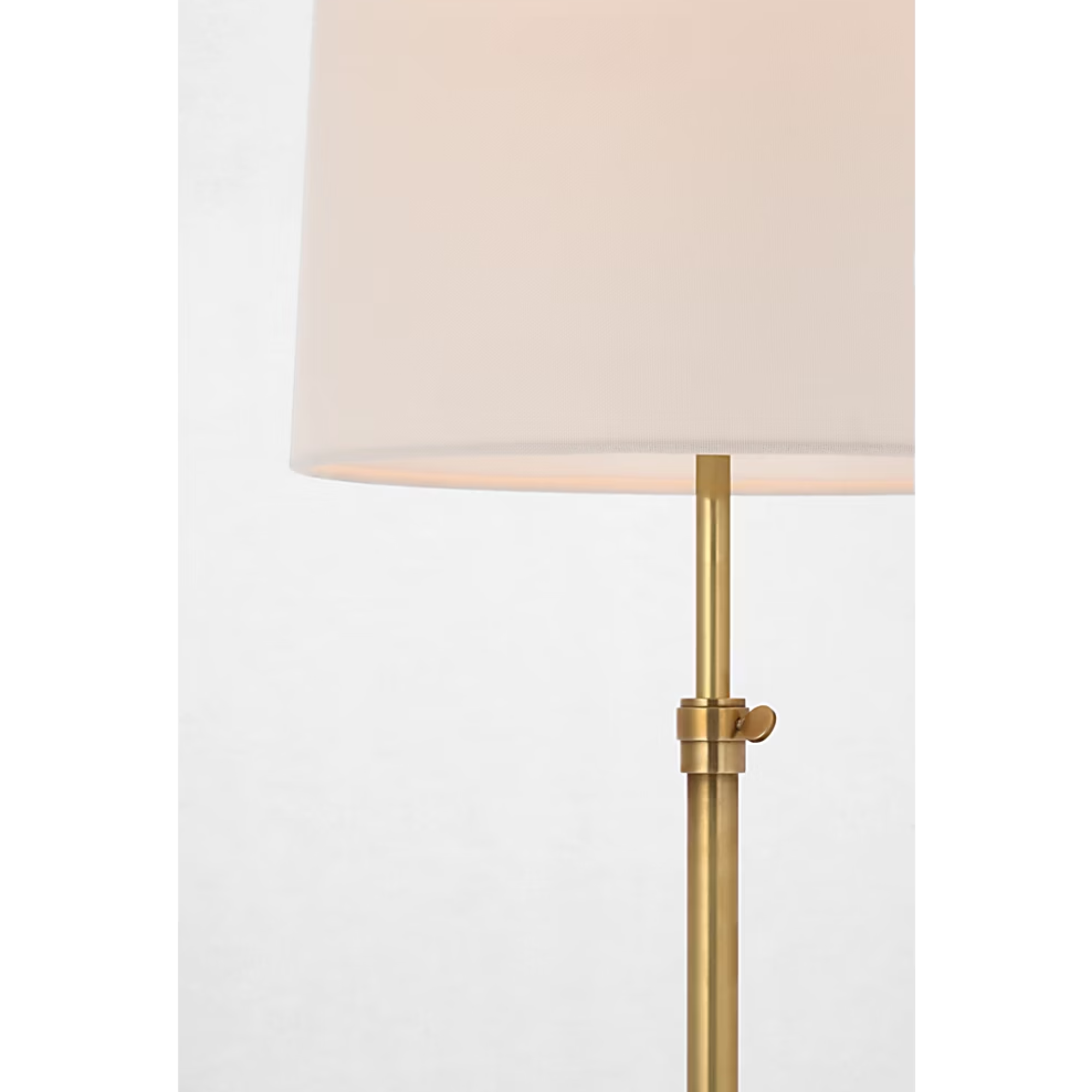 The brass Bryant Adjustable Cordless Floor Lamp showing the shade and post with the adjustable height knob visible.