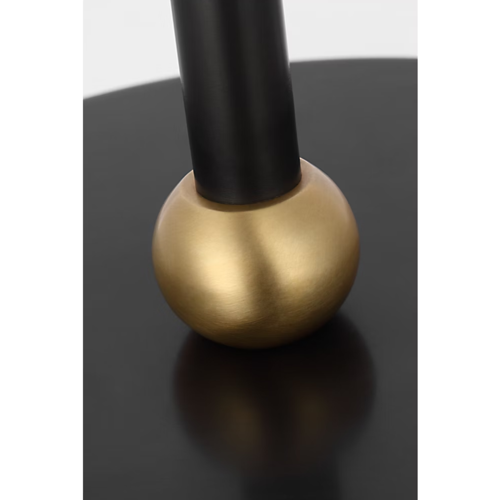 The bronze and hand rubbed antique brass Bryant Adjustable Cordless Floor Lamp base shown close up.