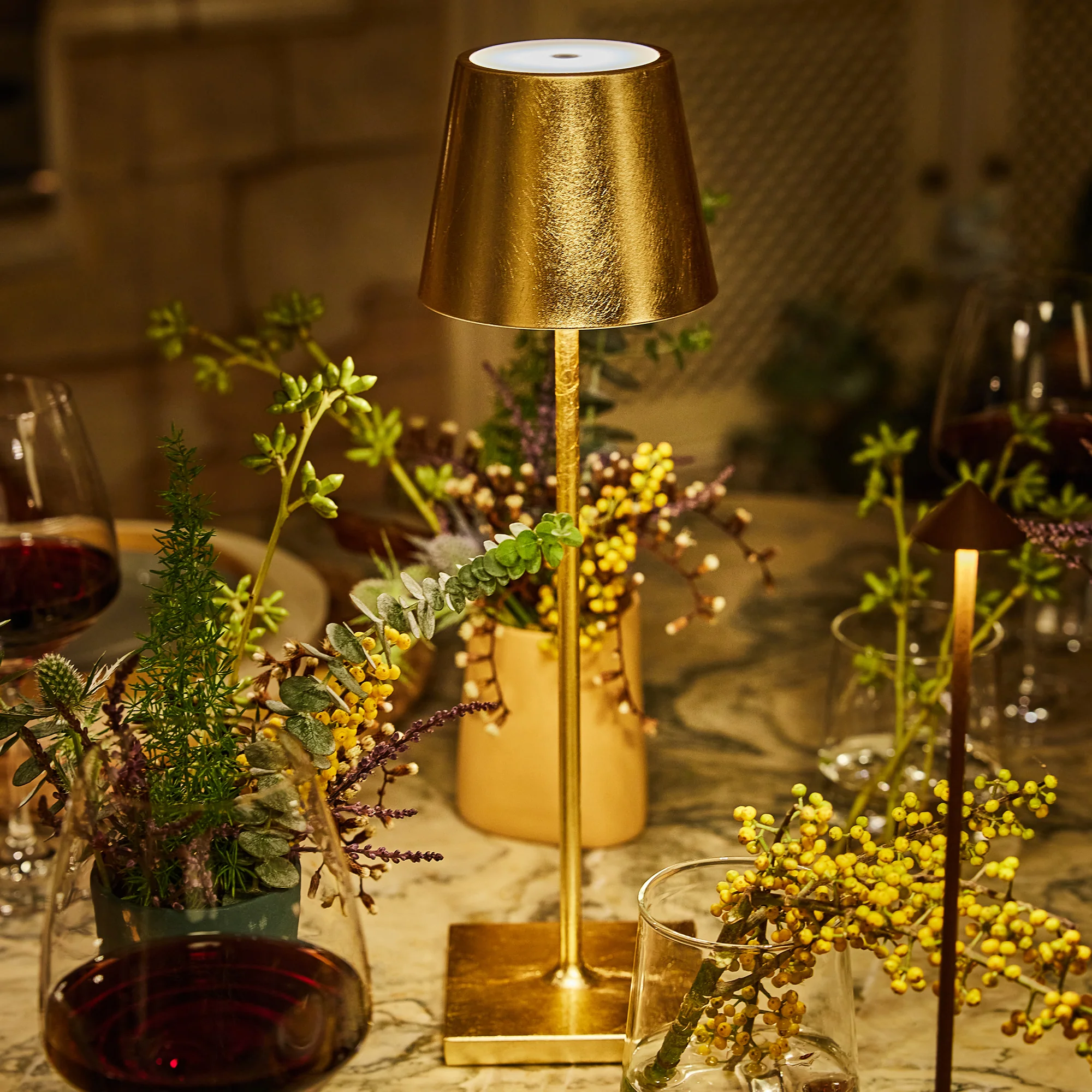 The gold leaf Poldina Pro from Zafferano in a designer home on top of a marble table.