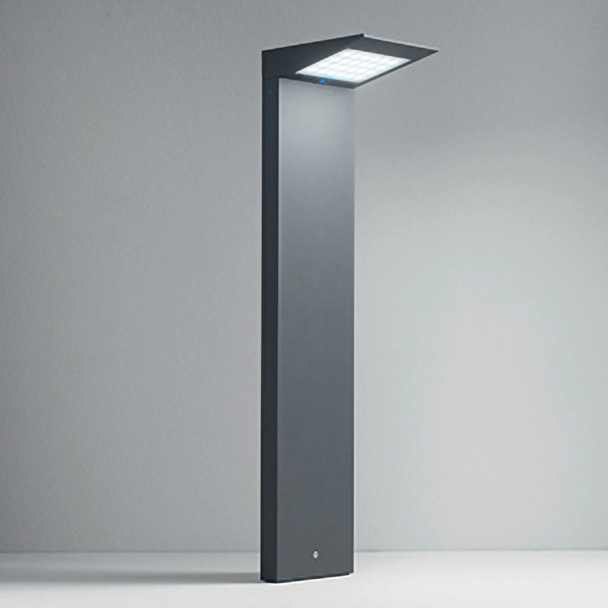 The dark gray Solar Outdoor LED Bollard from Zafferano in a studio.