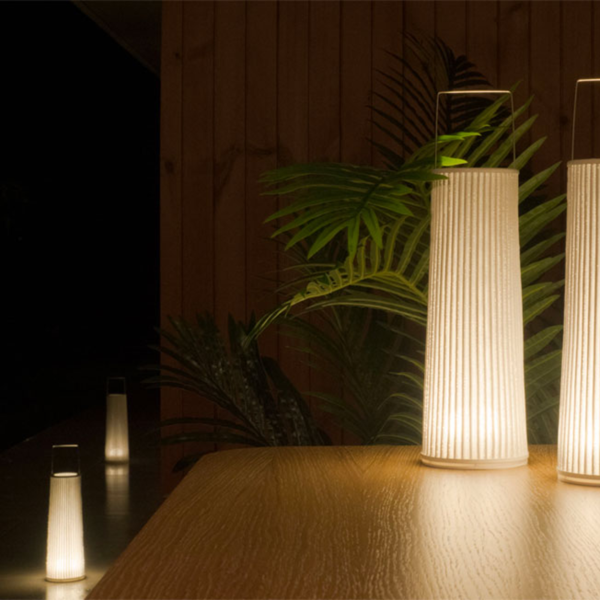 The Hipatia Cordless Lamp from a-emotional light in a living room.