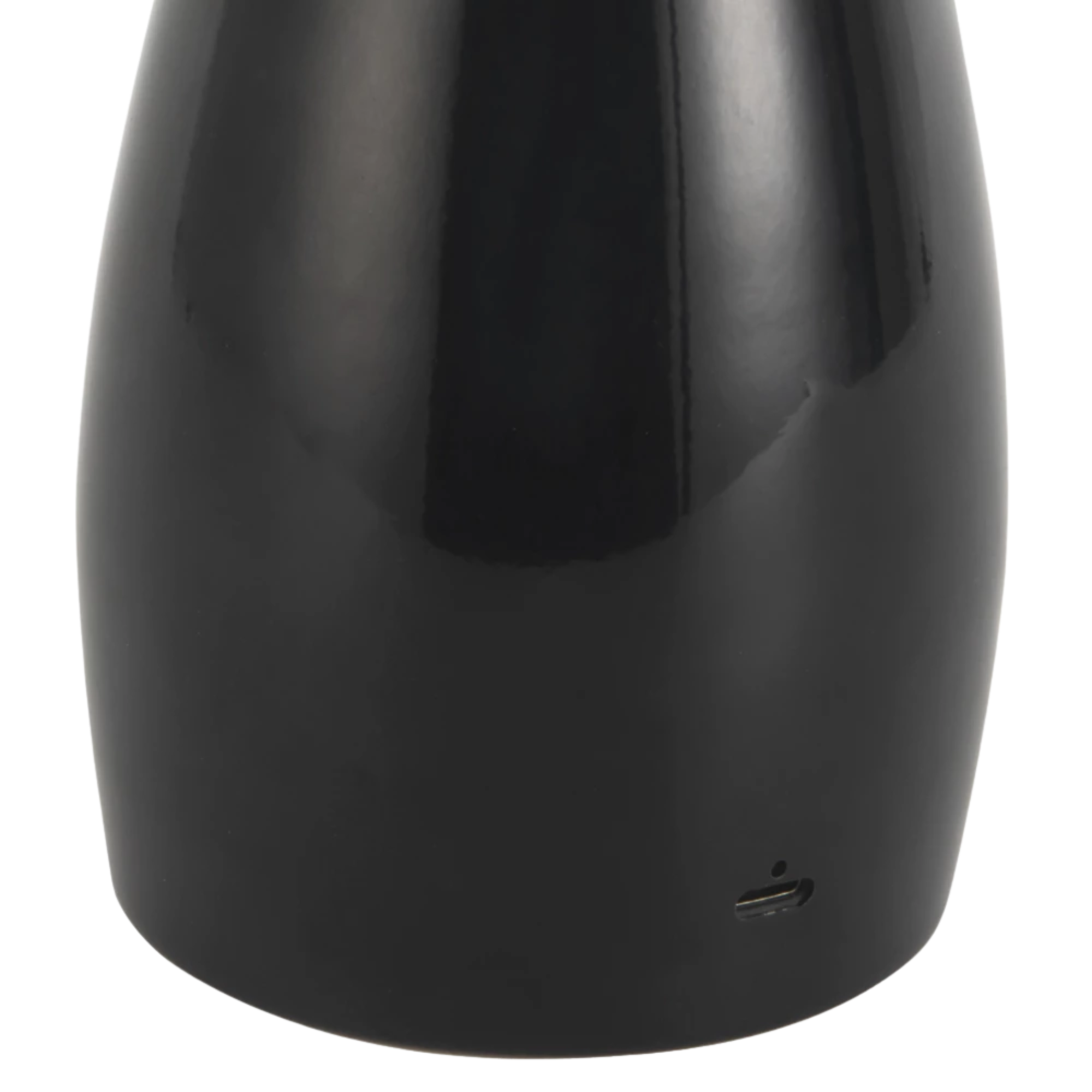 The black Poppy Cordless Lamp from Alora Mood charging port.