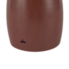 The burgundy Poppy Cordless Lamp from Alora Mood charging port.