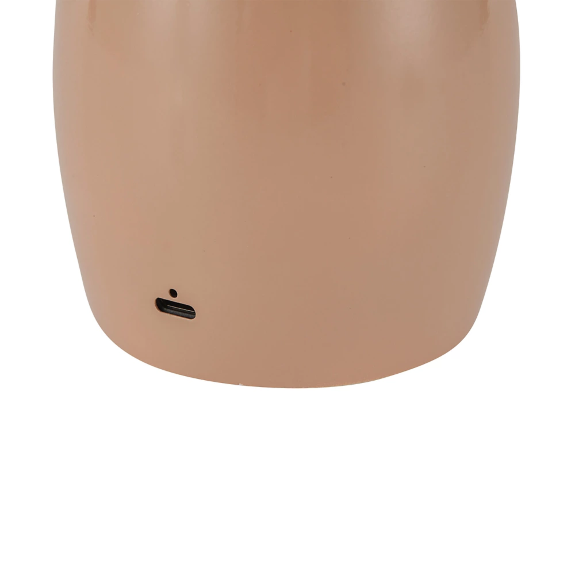 The peach Poppy Cordless Lamp from Alora Mood charging port.