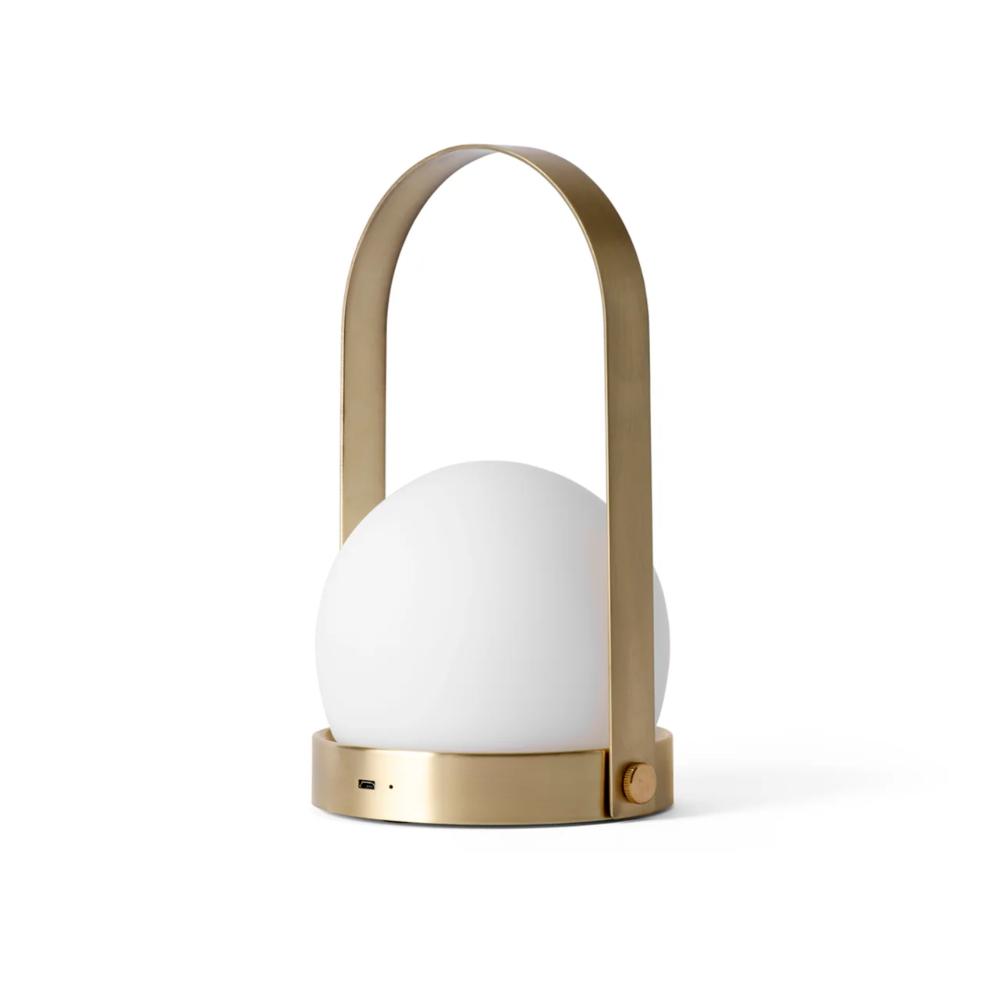 The brushed brass Carrie Portable Table Lamp from Audo Copenhagen.