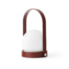 The burned red Carrie Portable Table Lamp from Audo Copenhagen.