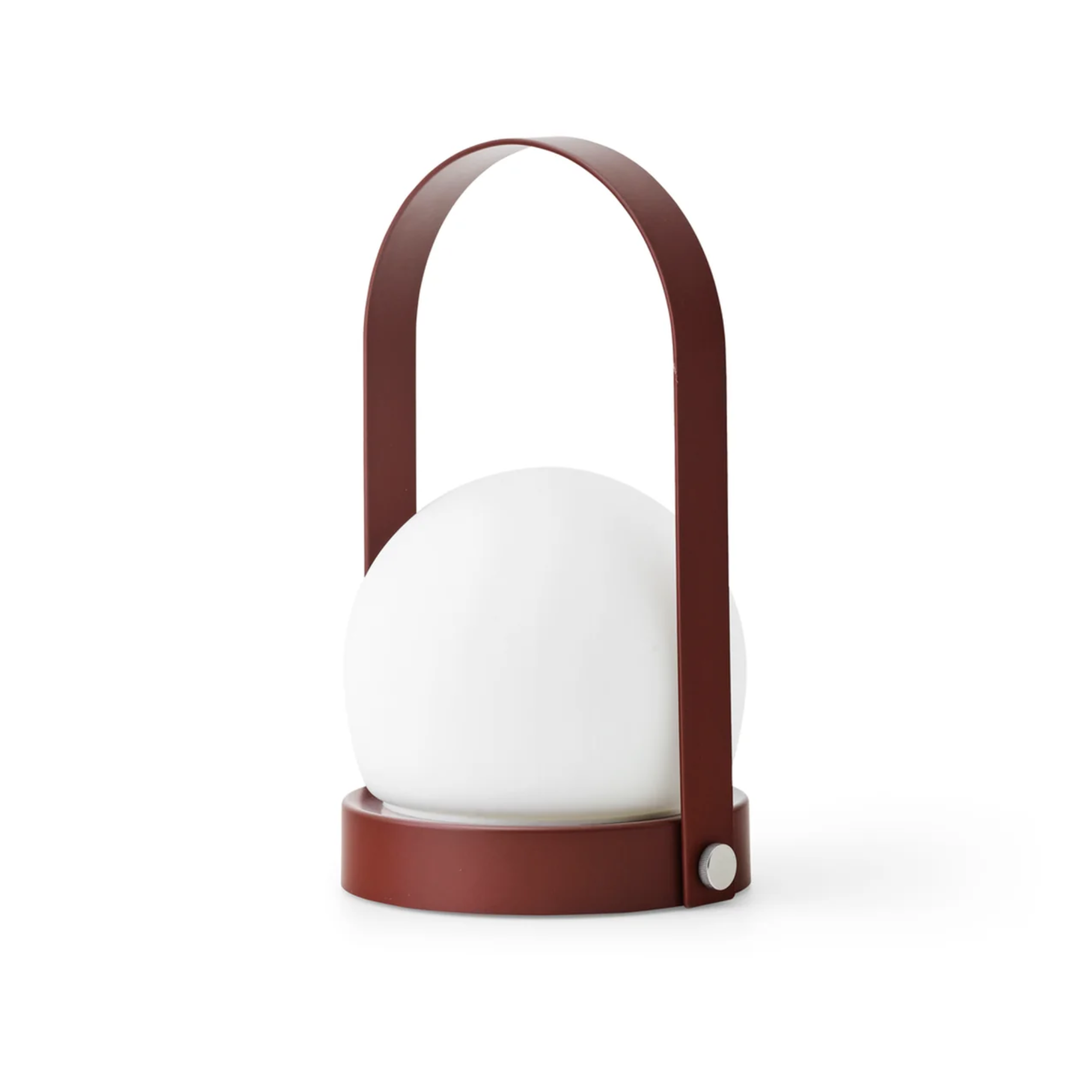 The burned red Carrie Portable Table Lamp from Audo Copenhagen.