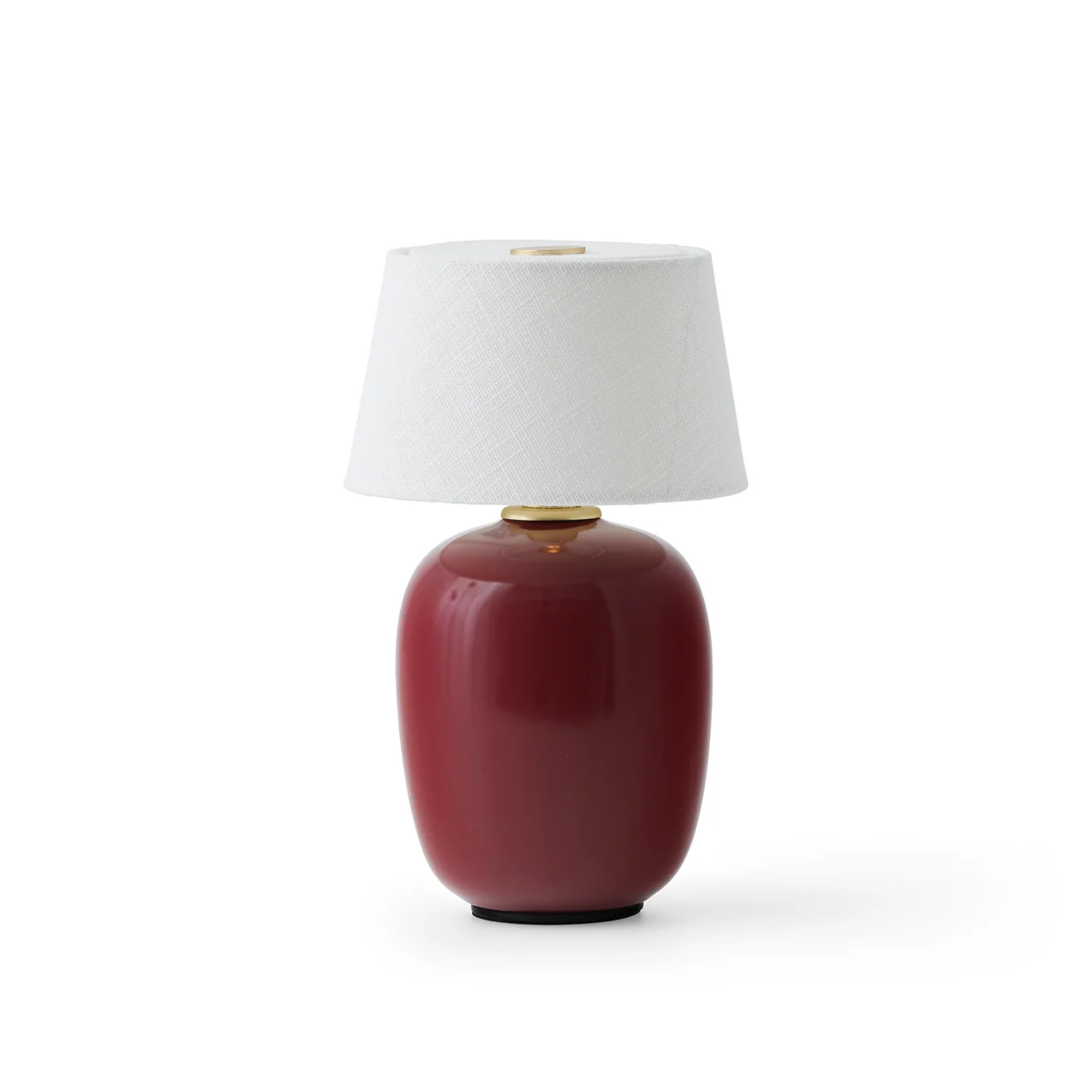 The ruby Torso Portable Table Lamp from Audo Copenhagen turned off.