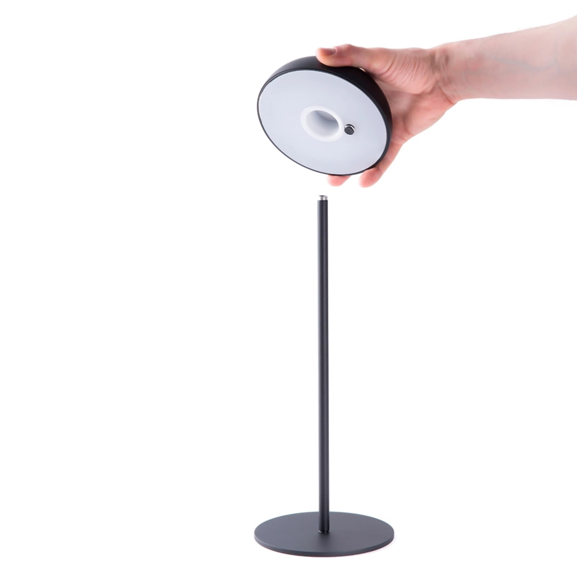 The black Float Cordless Lamp from Axolight showing the light's function. all-groups