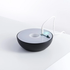 The black Float Cordless Lamp from Axolight charging. all-groups