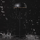 The black Float Cordless Lamp from Axolight showing its waterproof features. all-groups