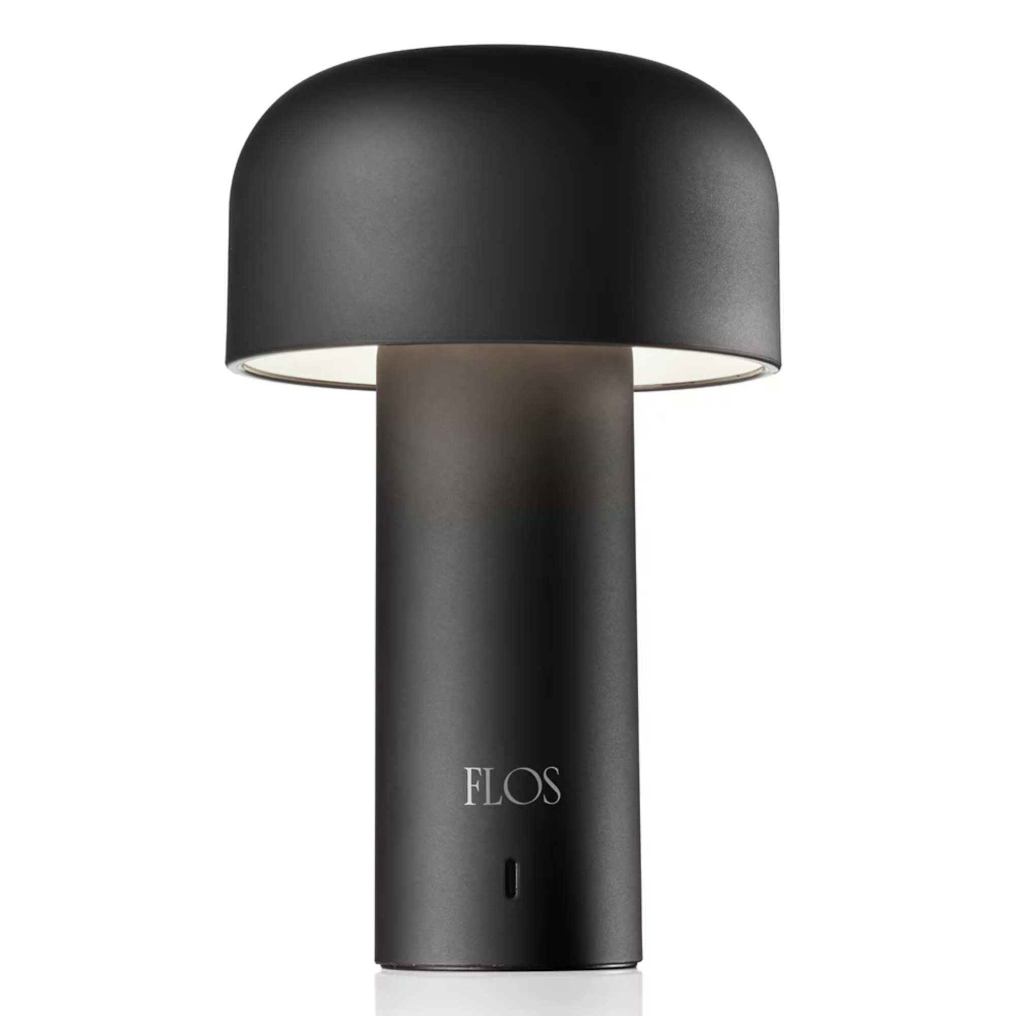 The back of the matte black Bellhop Cordless Lamp from FLOS, showing the direct USB-C charging port.