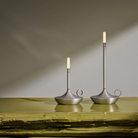 The aluminum Wick Cordless Lamp from Graypants in a lounge, showing the small and large portable light side by side. all-groups