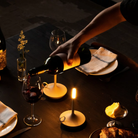 The Wick Pro Cordless Lamp from Graypants in a family area illuminating a dining table.