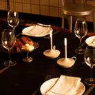 The Wick Pro Cordless Lamp from Graypants in a living space, used on a dining table.