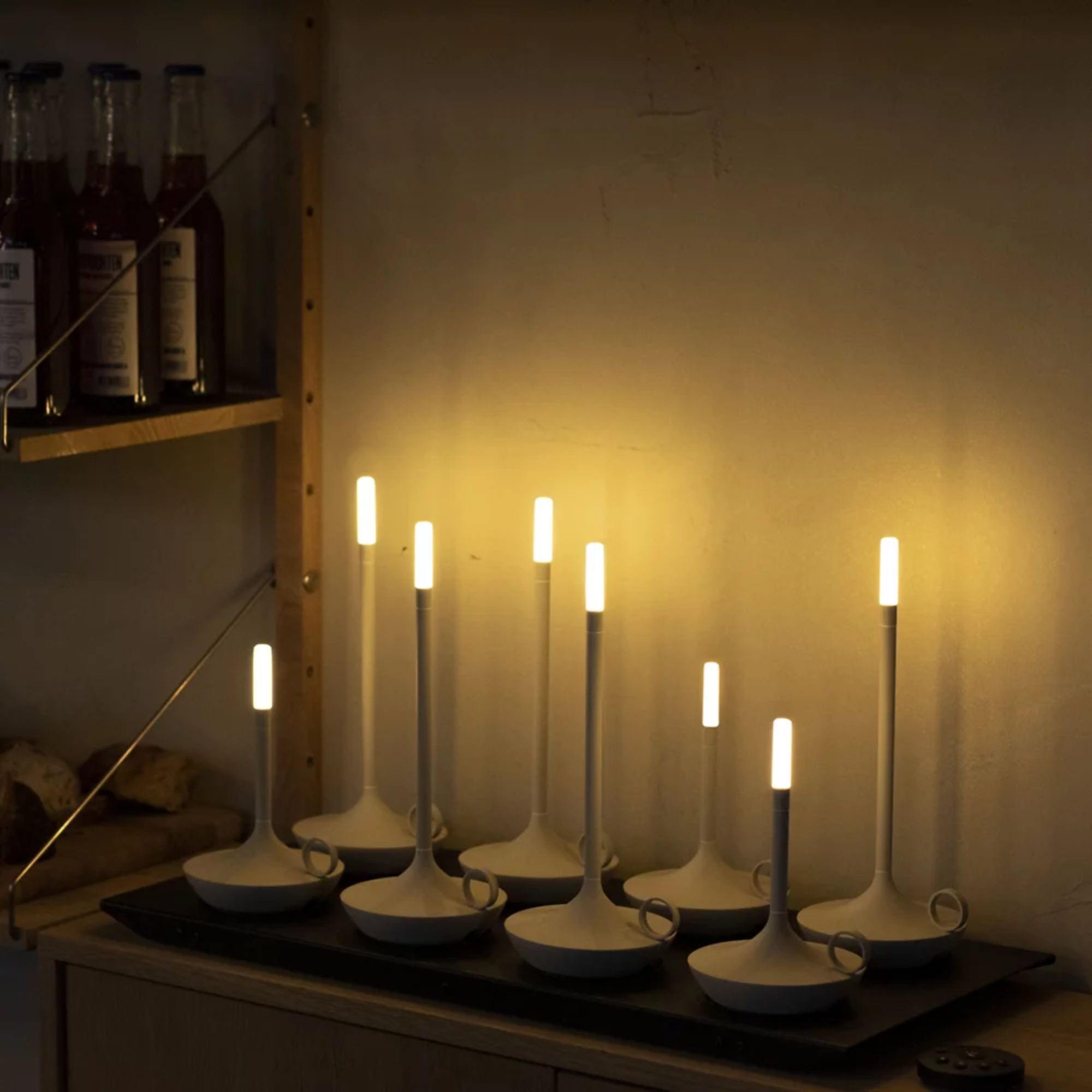 The Wick Pro Cordless Lamp from Graypants shown with multiple lights charging at once, perfect for hospitality settings like restaurants, cafes, hotels and more. all-groups