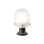 The Seine Portable Table Lamp from GUBI at full brightness.