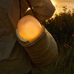 The Seine Portable Table Lamp from GUBI used for outdoor dining.