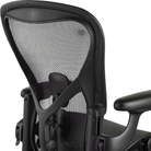 The Adjustable Posturefit SL back of the Aeron Office Chair from Herman Miler shown close up.