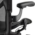 The arm of the Aeron Office Chair from Herman Miller shown close up highlighting the adjustable arms.