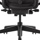 The base of the black and onyx Aeron Office Chair from Herman Miller shown close up.