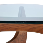 The walnut Noguchi Table from Herman Miller etched Isamu Noguchi signature close up.