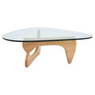 The white oak Noguchi Table from Herman Miller shown close up to highlight the finish and glass.
