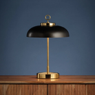 The Hector Cordless Table Lamp from Hudson Valley Lighting in a family area.