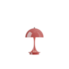 The coral Panthella 160 Portable Lamp from Louis Poulsen turned on.