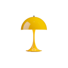 The opaque yellow Panthella 250 Portable Lamp from Louis Poulsen turned on.
