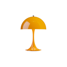 The orange Panthella 250 Portable Lamp from Louis Poulsen turned on.