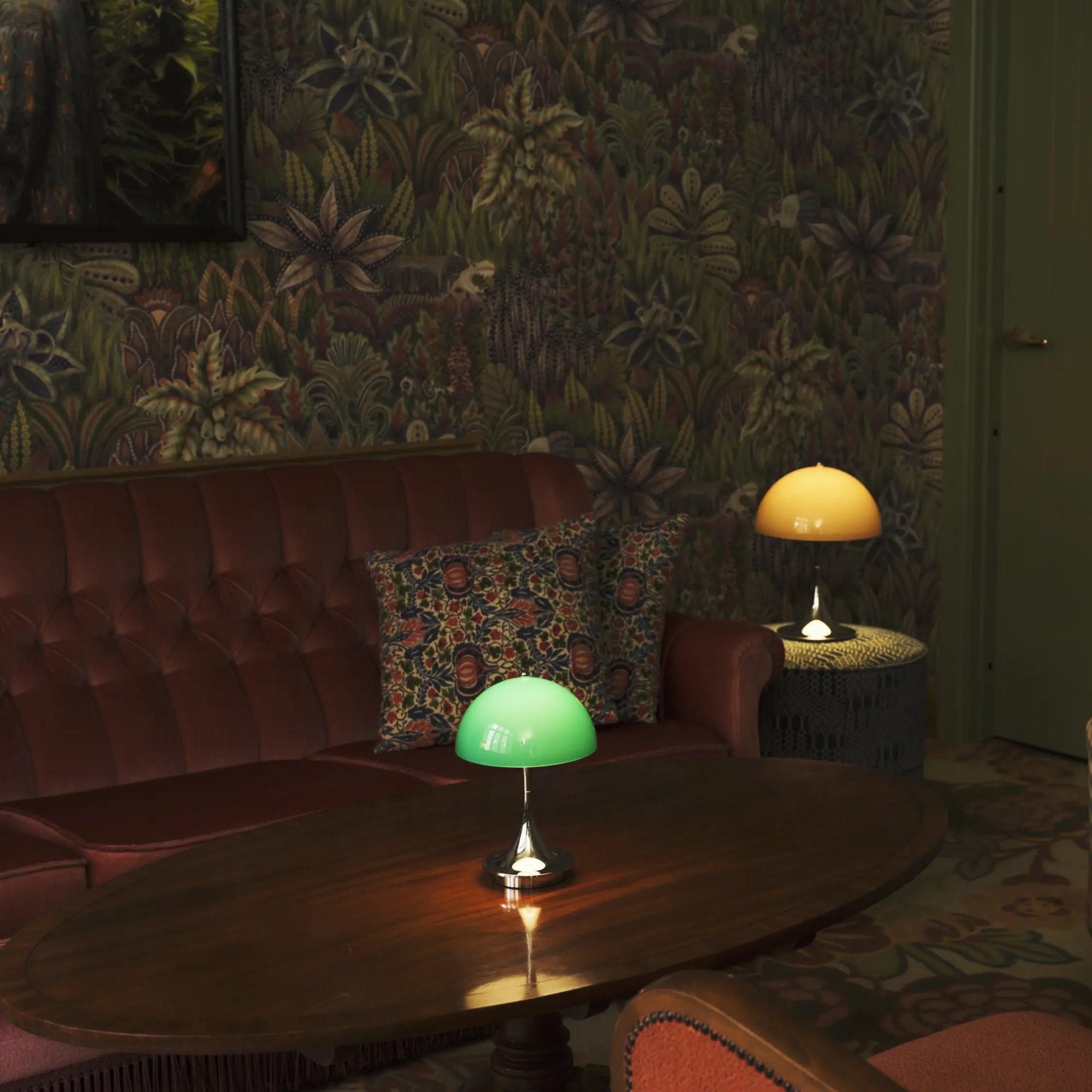 The 9.5 inch green Panthella Portable Lamp: The Originals from Louis Poulsen in a bar.
