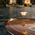 The brass PH 1/1 Portable Lamp from Louis Poulsen on the mast of a yacht.