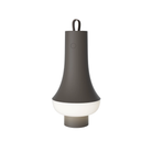 The dark brown Tomoshi Portable Lamp from Louis Poulsen turned on.