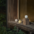 All three color options for the VL45 Radiohus Table Lamp from Louis Poulsen in an outdoor family space. all-groups