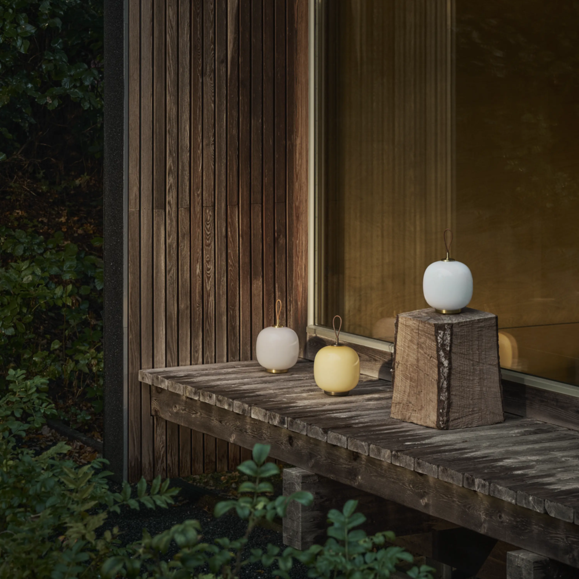 All three color options for the VL45 Radiohus Table Lamp from Louis Poulsen in an outdoor family space. all-groups