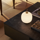 The pale rose VL45 Radiohus Table Lamp from Louis Poulsen in a living room turned on.
