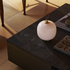 The pale rose VL45 Radiohus Table Lamp from Louis Poulsen in a lounge turned off.