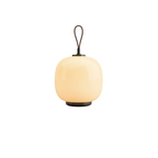 The pale yellow VL45 Radiohus Table Lamp from Louis Poulsen turned on.