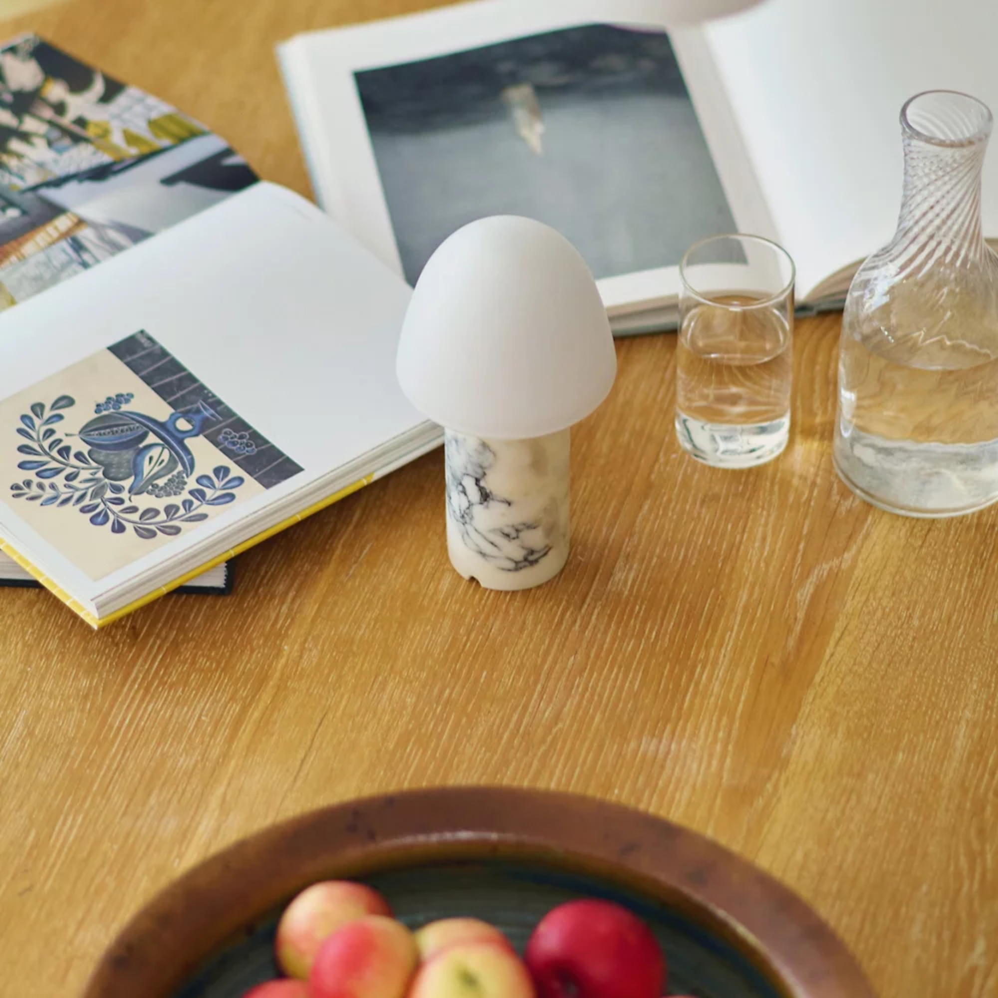 The Fuse Cordless Lamp from Made by Hand in a dining room on top of a dining table.
