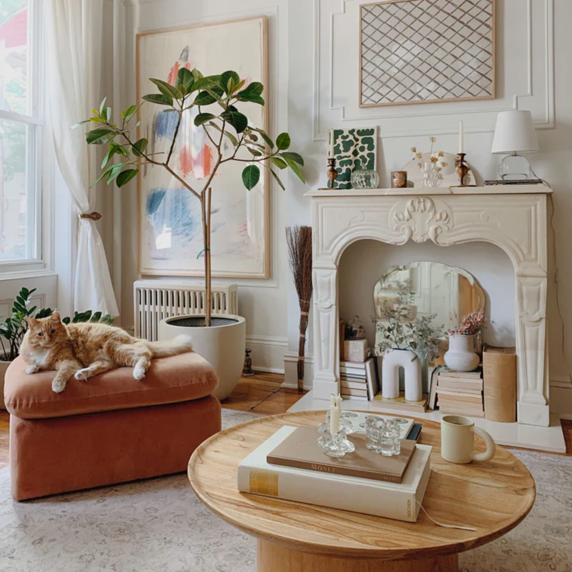 The Nicole Rechargeable LED Table Lamp from Mitzi in a lounge surrounded by other decor and furniture.