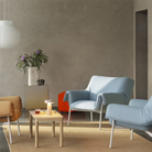 The gray Ease Cordless Lamp from Muuto in a family area on top of a coffee table.