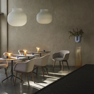 The gray Ease Cordless Lamp from Muuto used in an indoor restaurant.